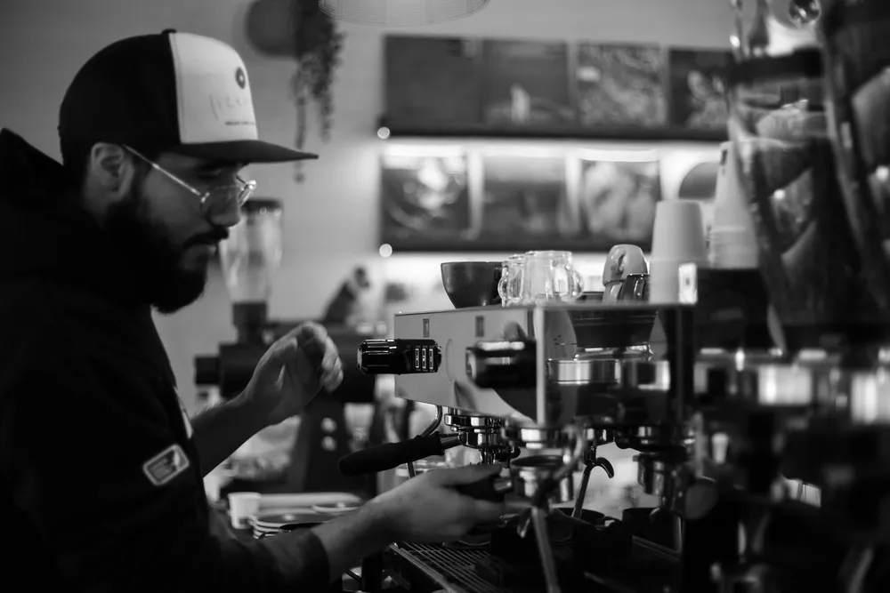 Barista pouring coffee